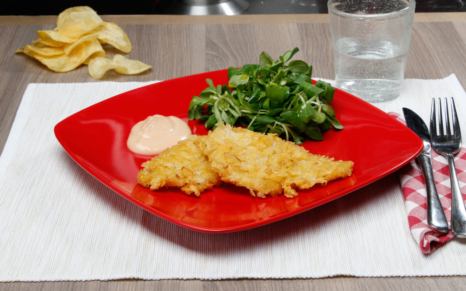 Filetti di platessa ricoperti con chips di patata