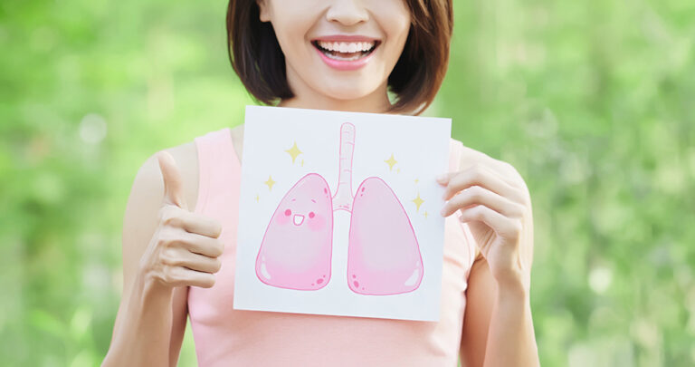 woman take health lung billboard and thumb up with green background