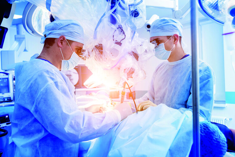 Spinal surgery. Group of surgeons in operating room with surgery equipment. Laminectomy. Modern medical background; Shutterstock ID 1499081681 Spinal surgery. Group of surgeons in operating room with surgery equipment. Laminectomy. Modern medical background; Shutterstock ID 1499081681