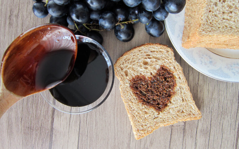grape molasses on wooden floor, slice of bread and wooden spoon. ; Shutterstock ID 1169016454; Pubblicazione: sld online grape molasses on wooden floor, slice of bread and wooden spoon. ; Shutterstock ID 1169016454; Pubblicazione: sld online