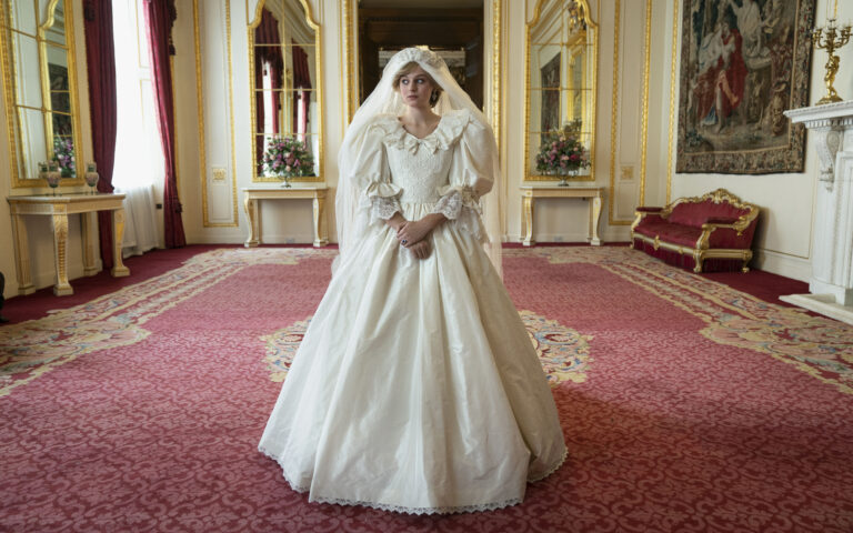 The Crown S4. Picture shows: Princess Diana (EMMA CORRIN)
The Crown costume designer wanted to create something that wasn’t an exact replica of Lady Diana’s original dress but which captured the same spirit and style of David & Elizabeth Emanuel’s iconic design.  Amy Roberts, our designer, spoke to David Emanuel in depth about the Emanuel’s original sketches and designs. He was fantastically collaborative and helpful to the design team and talked through the detail of many of the original drawings.