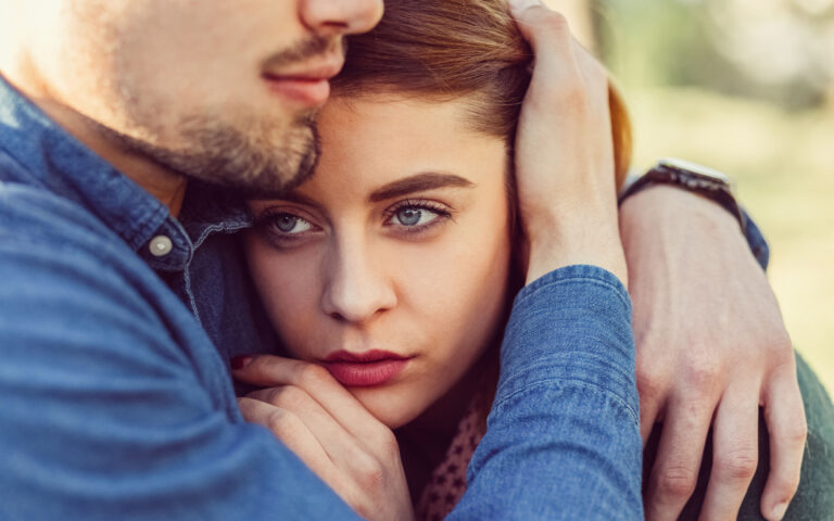 Мan soothing his girlfriend