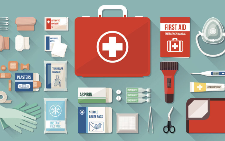 First aid kit box with medical equipment and medications for emergency, objects top view
