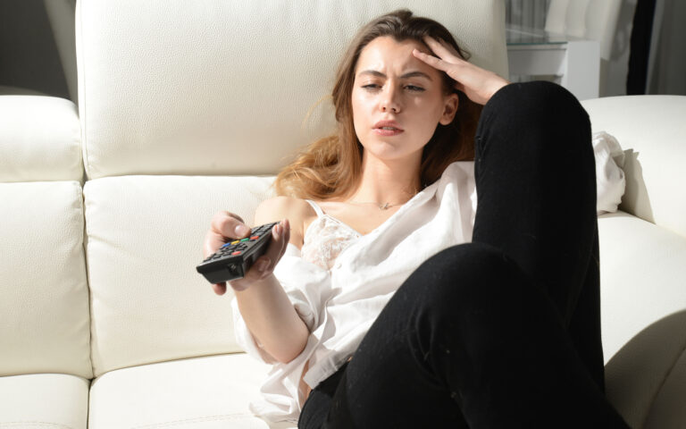 beautiful girl is bored watching tv beautiful girl is bored watching tv