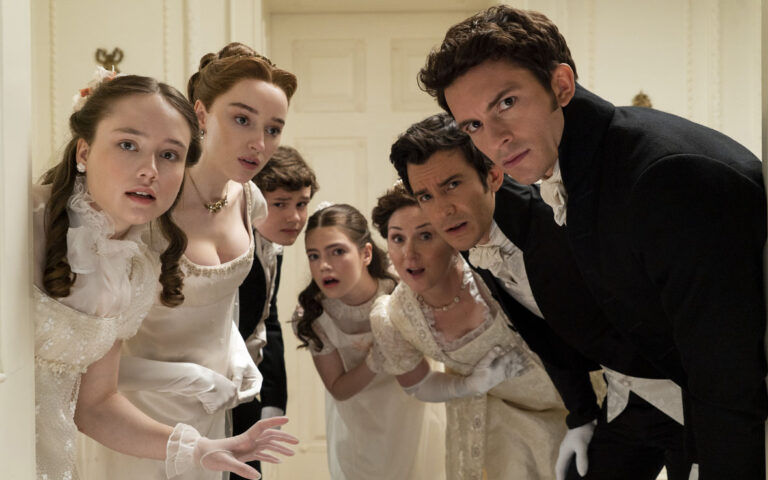 Bridgerton. (L to R) Ruby Stokes as Francesca Bridgerton, Phoebe Dyvenor as Daphne Basset, Will Tilston as Gregory Bridgerton, Florence Emilia Hunt as Hyacinth Bridgerton, Ruth Gemmell as Lady Violet Bridgerton, Luke Thompson as Benedict Bridgerton, Jonathan Bailey as Anthony Bridgerton in episode 201 of Bridgerton. Cr. Liam Daniel/Netflix © 2022