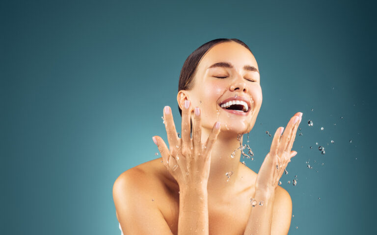 Woman washing up her face