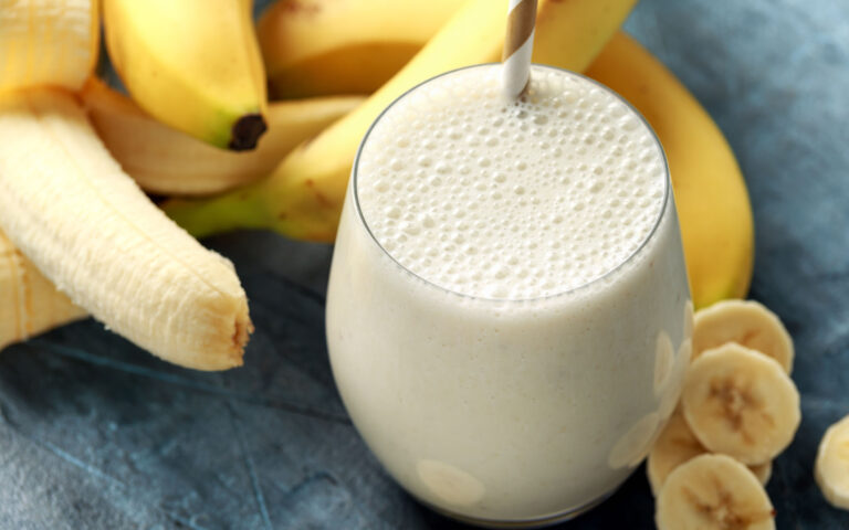 Banana smoothie in glass for healthy breakfast. Banana smoothie in glass for healthy breakfast.