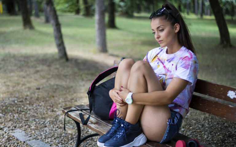 Thoughtful woman in the park
