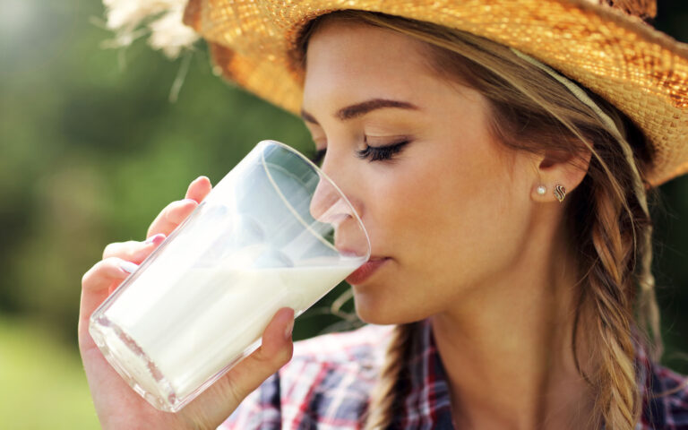 Picture of young woman with fresh organic milk Picture of young woman with fresh organic milk