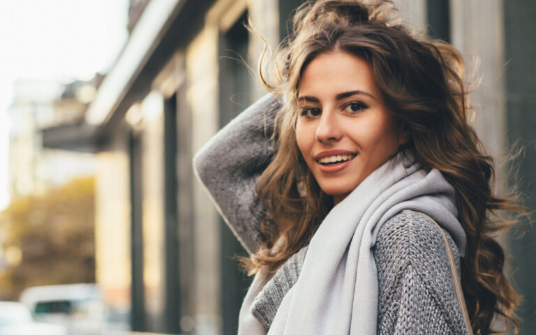 Portrait of a beautiful young woman outdoors.