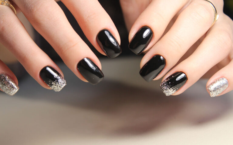 Evening manicure design in black and gold color