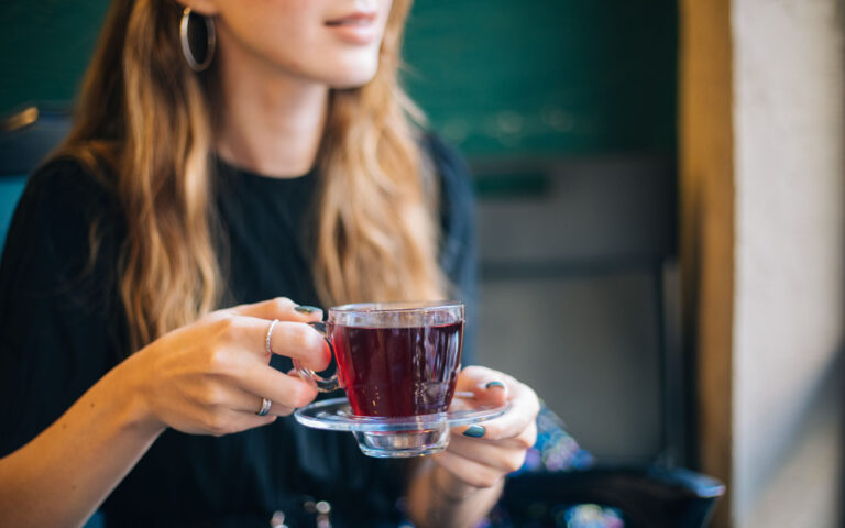 Woman having winter tea at coffee Woman having winter tea at coffee