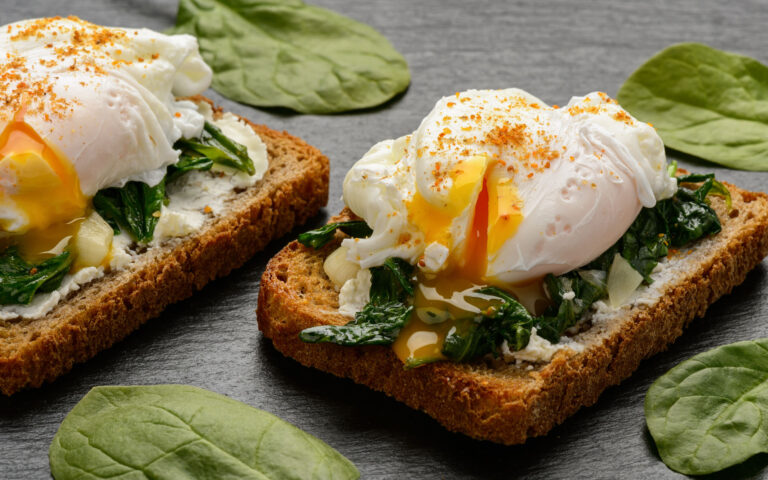 Healthy breakfast - sandwich with cheese, spinach and poached egg. Healthy breakfast - sandwich with cheese, spinach and poached egg.